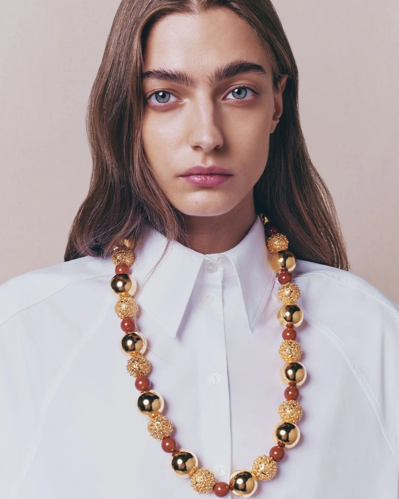 Gold Sculptural Necklace With Red Pearl Detail - Image 4