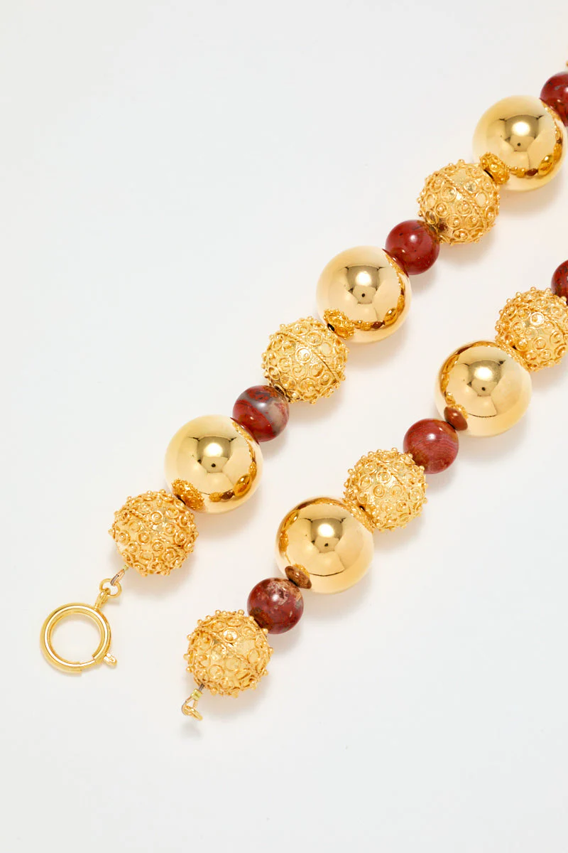 Gold Sculptural Necklace With Red Pearl Detail - Image 7